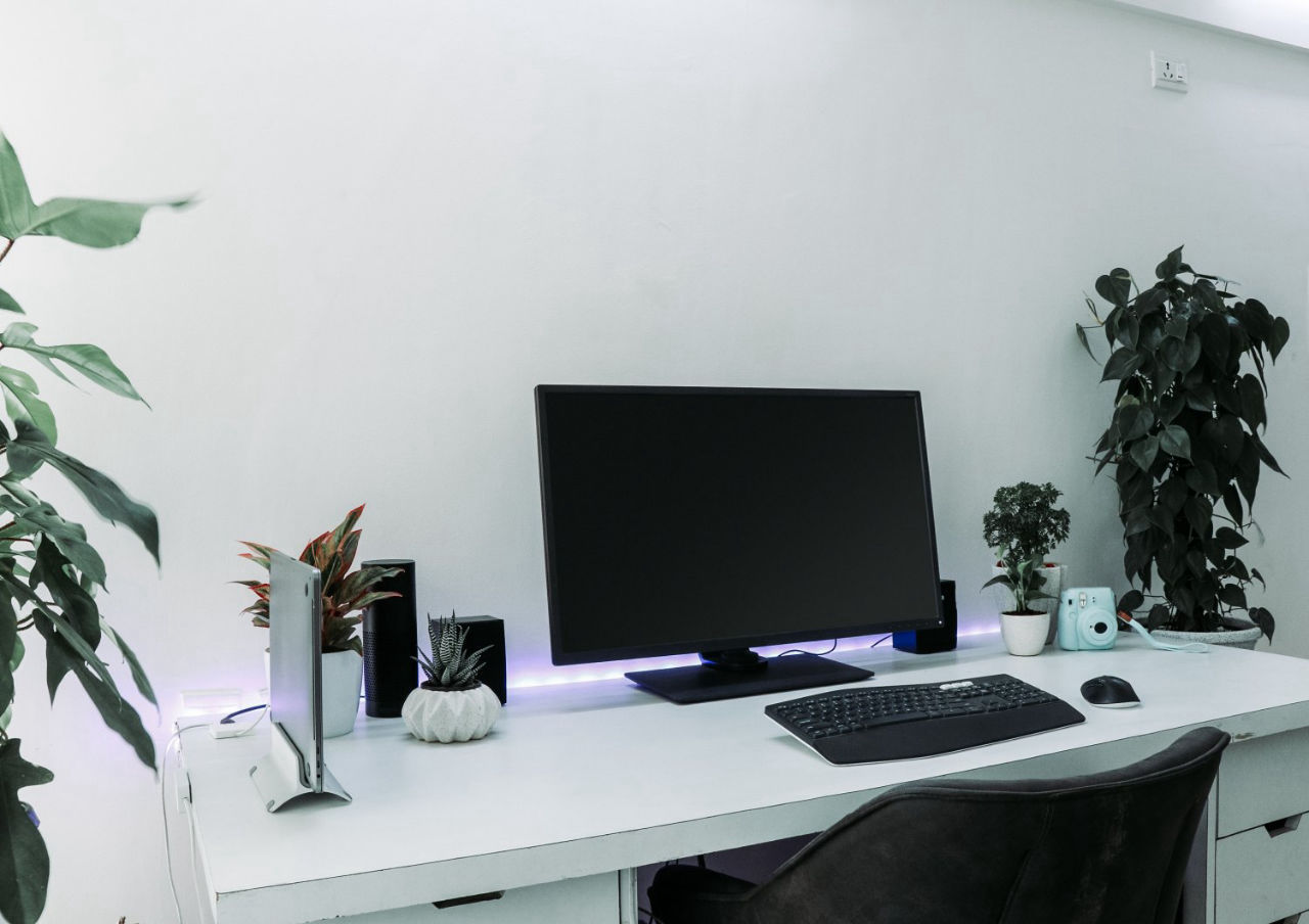 PC on white desk mockup MockupsJar